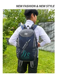 Rear view of 40L navy blue hiking backpack with YANAHEIMER logo on male model
