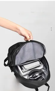 Detail of backpack interior showing striped lining and 14-inch laptop compartment