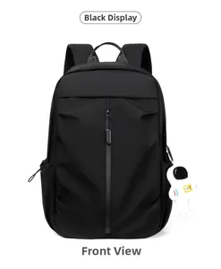 Front view of black casual backpack featuring vertical zipper and astronaut pendant