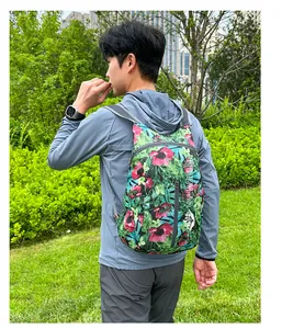 Detail of tropical floral foldable backpack with breathable mesh straps for hiking
