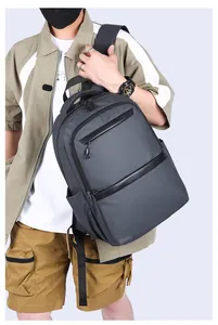 Detail of a dark grey business laptop backpack featuring water-resistant nylon material