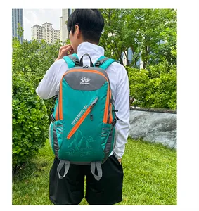 Detail showing a 40L green hiking backpack with orange zippers and breathable mesh side pocket