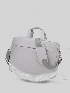 Macro shot of lightweight grey laptop bag showing fabric texture and shoulder strap