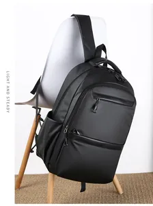 Close-up of waterproof black business backpack with multiple zipper compartments