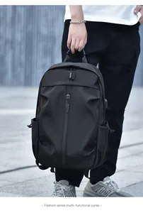 Detailed view of black waterproof nylon backpack featuring multi-layer zippers and side pockets