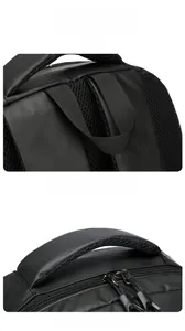 Close-up of wide padded handle and dual zipper system on a black business backpack