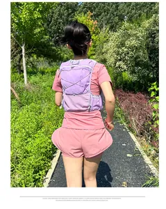 Detail view of purple lightweight mesh running vest with elastic cords and multi-pockets