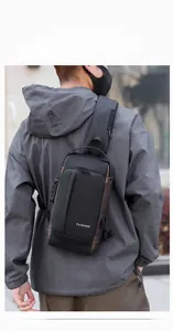 Close-up of black anti-theft sling bag featuring secure side combination lock and durable fabric