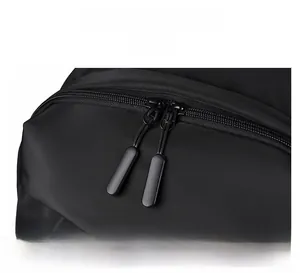 Detailed close-up of smooth dual matte zippers on a durable black nylon travel backpack