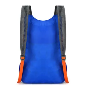 Lightweight foldable waterproof travel backpack in royal blue with orange straps