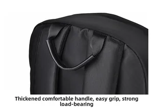Detail of the thickened ergonomic leather handle on a large black travel backpack
