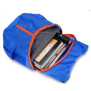 Foldable lightweight blue waterproof backpack with orange zippers for outdoor travel