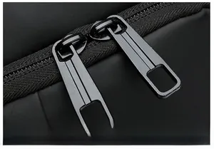 Detail of waterproof chest bag featuring heavy-duty dual matte black metal zippers