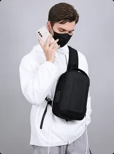 Close-up of anti-theft combination lock and USB charging port on hard shell chest bag