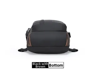 Close-up of the black and brown waterproof crossbody bag showing the bottom and side zipper