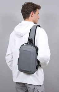 Detail of cross-body bag featuring an anti-theft combination lock and USB charging port