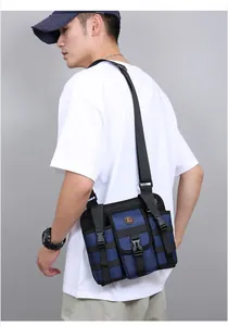 Close-up of navy blue tactical crossbody bag with adjustable straps and side water bottle pocket