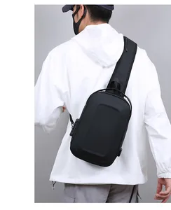 Detail of the anti-theft combination lock and USB charging port on the hardshell chest bag