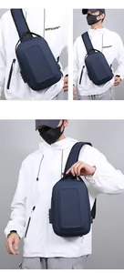 Detail view of the side anti-theft combination lock and USB charging port on the chest bag