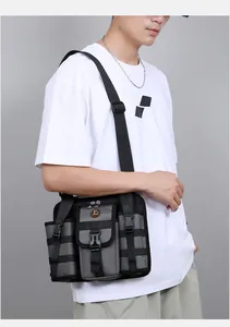 Detail view of tactical crossbody bag showing durable nylon fabric and functional buckles