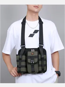 Close-up of olive green tactical chest bag with adjustable straps and multi-pocket detail