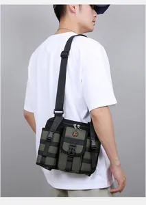 Detail of army green tactical sling bag with functional pockets and adjustable strap