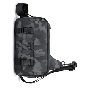 Detail of camouflage crossbody bag featuring adjustable straps and durable plastic buckles