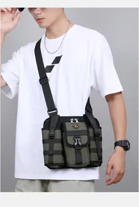 Detailed view of army green tactical crossbody bag with MOLLE webbing and buckle
