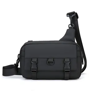 Detail view of black tactical crossbody bag showing durable nylon and double buckle closure