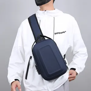 Men's navy blue hardshell sling bag with TSA lock and external USB charging port