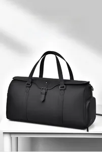 Macro detail of waterproof black duffle bag featuring smooth leather texture and side zipper