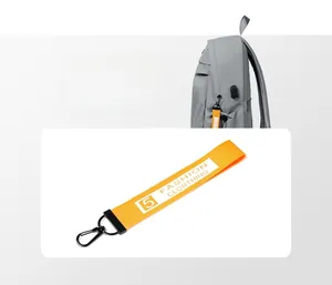 Detail of orange polyester zipper pull with metal hook for a waterproof backpack