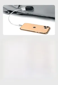 Close-up of external USB charging port and headphone jack on gray waterproof backpack