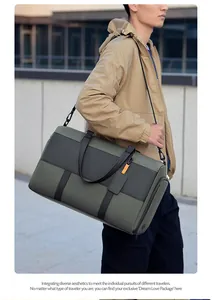Detail of moss green travel bag showing adjustable shoulder strap and large capacity