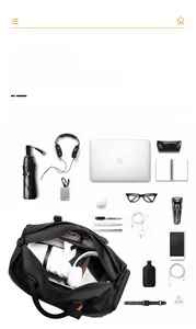 Flat lay of black large capacity gym bag showing organized storage for travel gear