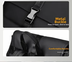 Detail of silver metal buckle and reinforced top handle on a black waterproof backpack