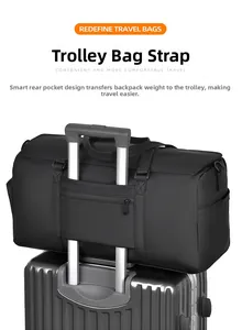 Detail view of the luggage strap on the back of a black waterproof business travel bag
