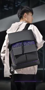 Detail of man's geometric pattern backpack featuring dual front pockets and drawstring closure