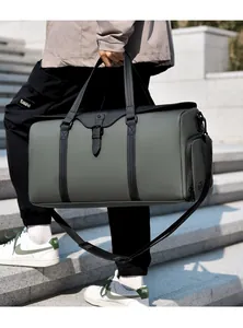 Detail of water-resistant travel bag showing side zipper pocket and dark green matte fabric