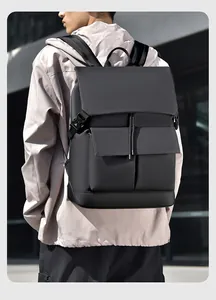 Detail of matte waterproof black backpack with buckle closure on male model