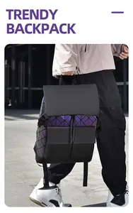 Detail of reflective geometric diamond pattern backpack with buckle pockets on city street