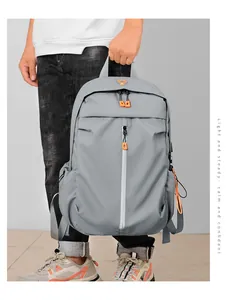Close-up of waterproof business backpack with reflective stripe and orange zipper details