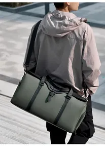 Detail of army green travel bag with waterproof matte fabric and adjustable strap