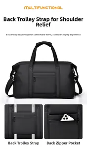 Detail of the trolley sleeve and back zipper pocket on this black travel duffel bag