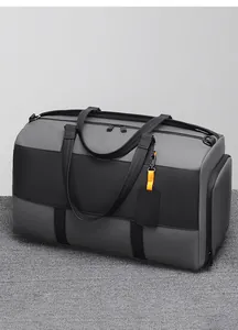 Detail of travel duffel bag showing water-resistant fabric and side shoe compartment