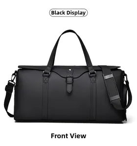 Front view of large black waterproof travel bag with dual handles and shoulder strap