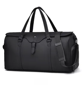 Detailed side view of black waterproof travel bag with reinforced handles and side pocket