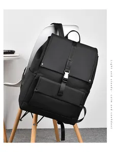 Close-up of waterproof matte black backpack featuring a silver metal buckle and flap