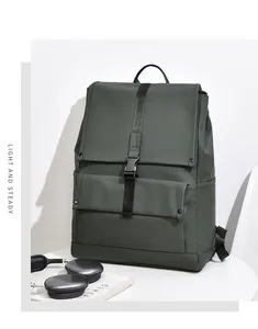 Detail of army green travel backpack featuring textured fabric and secure buckle straps