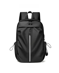 Detail of waterproof black backpack with reflective stripe and integrated USB charging port